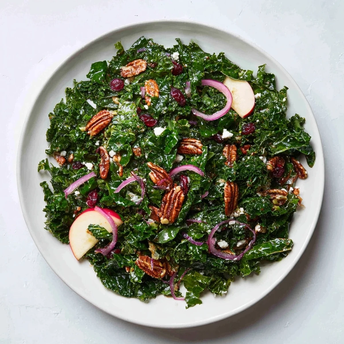 Close-up of a rustic bowl filled with fresh Winter Kale Salad, delicious and healthy.