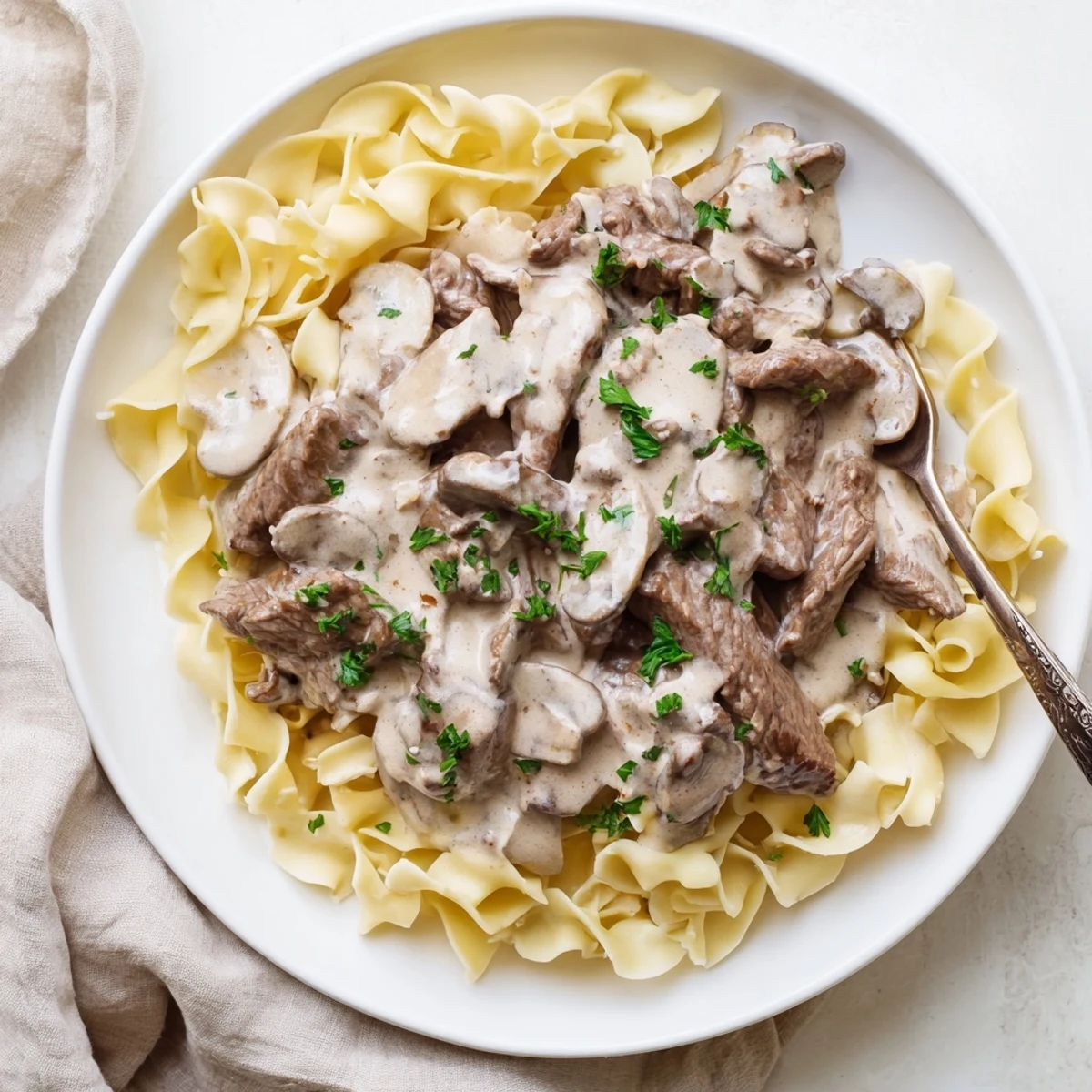 Beef Stroganoff over Egg Noodles makes a comforting, classic American dinner for weeknights.  