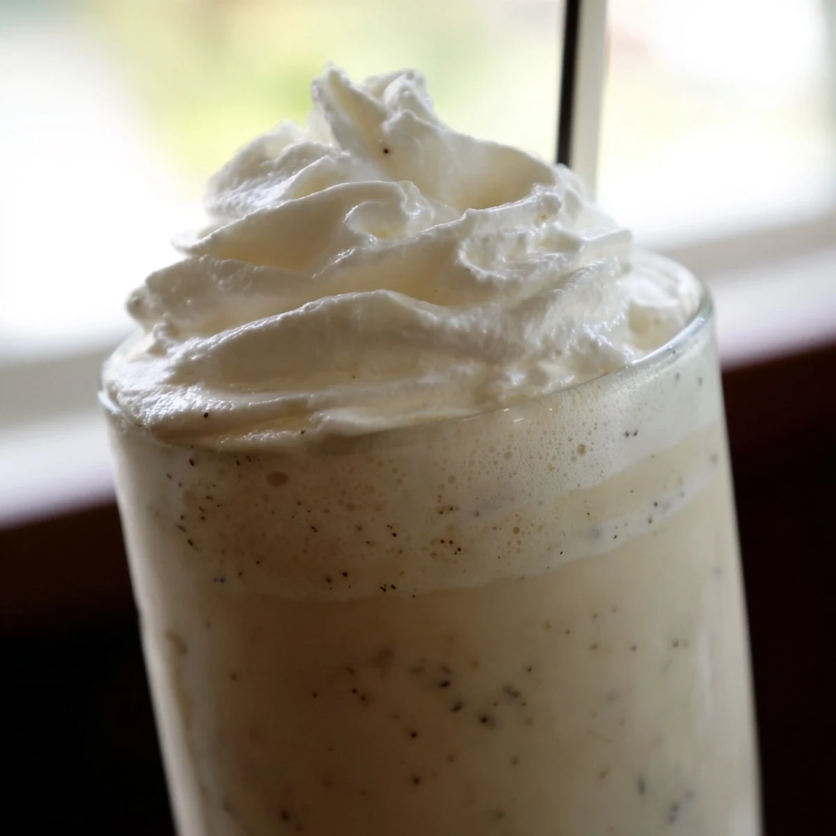 Refreshing Starbucks Vanilla Bean Frappuccino poured from blender into glasses, ideal for a cool homemade treat.