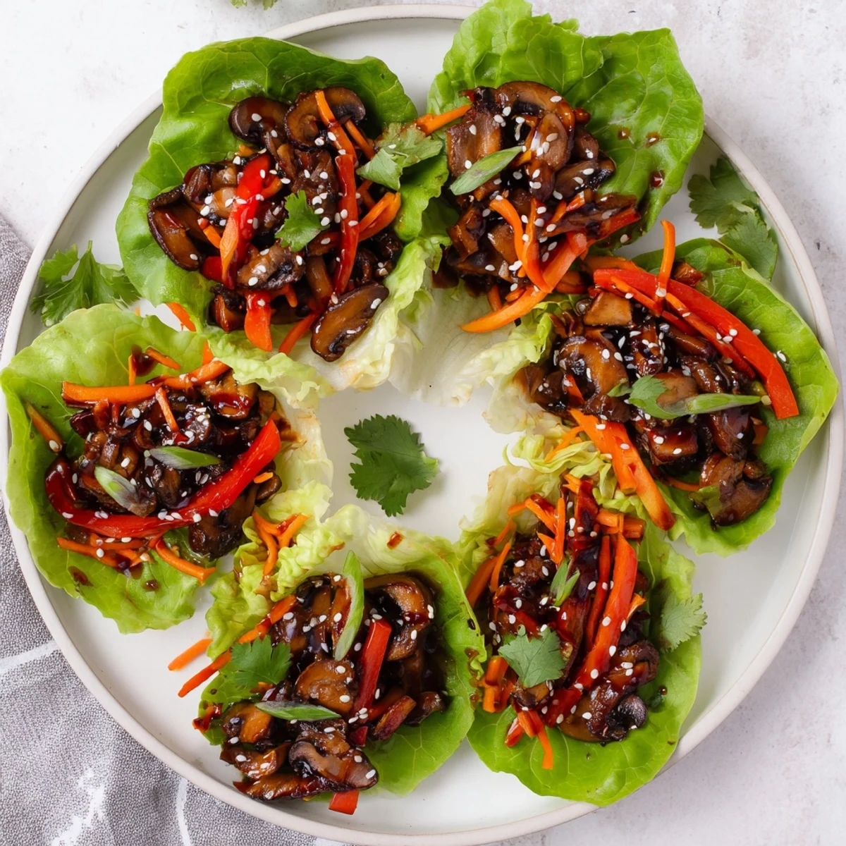 Spoon the glossy, Asian-inspired Shiitake Mushroom Lettuce Wraps into your hands and enjoy a light, satisfying vegetarian and gluten-free bite.