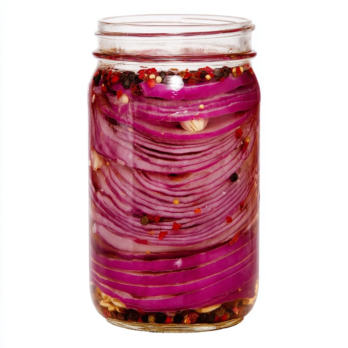 Glass jar filled with vibrant hot honey pickled red onions submerged in golden brine