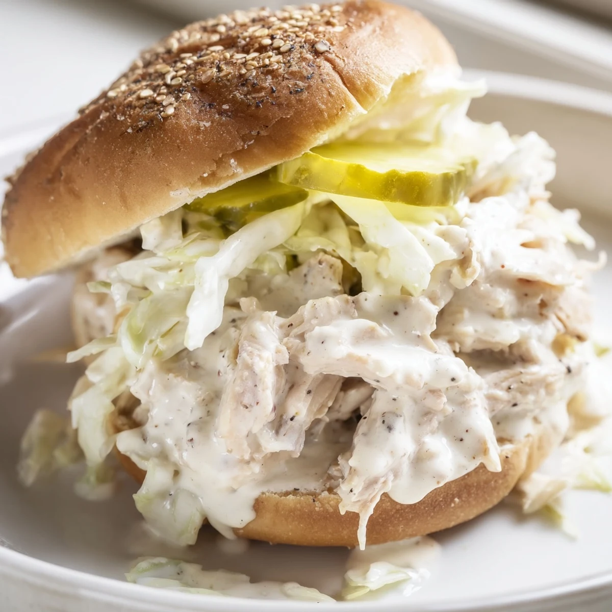 Alabama BBQ Chicken Chopped Sandwich with creamy white sauce and crisp slaw on toasted bun