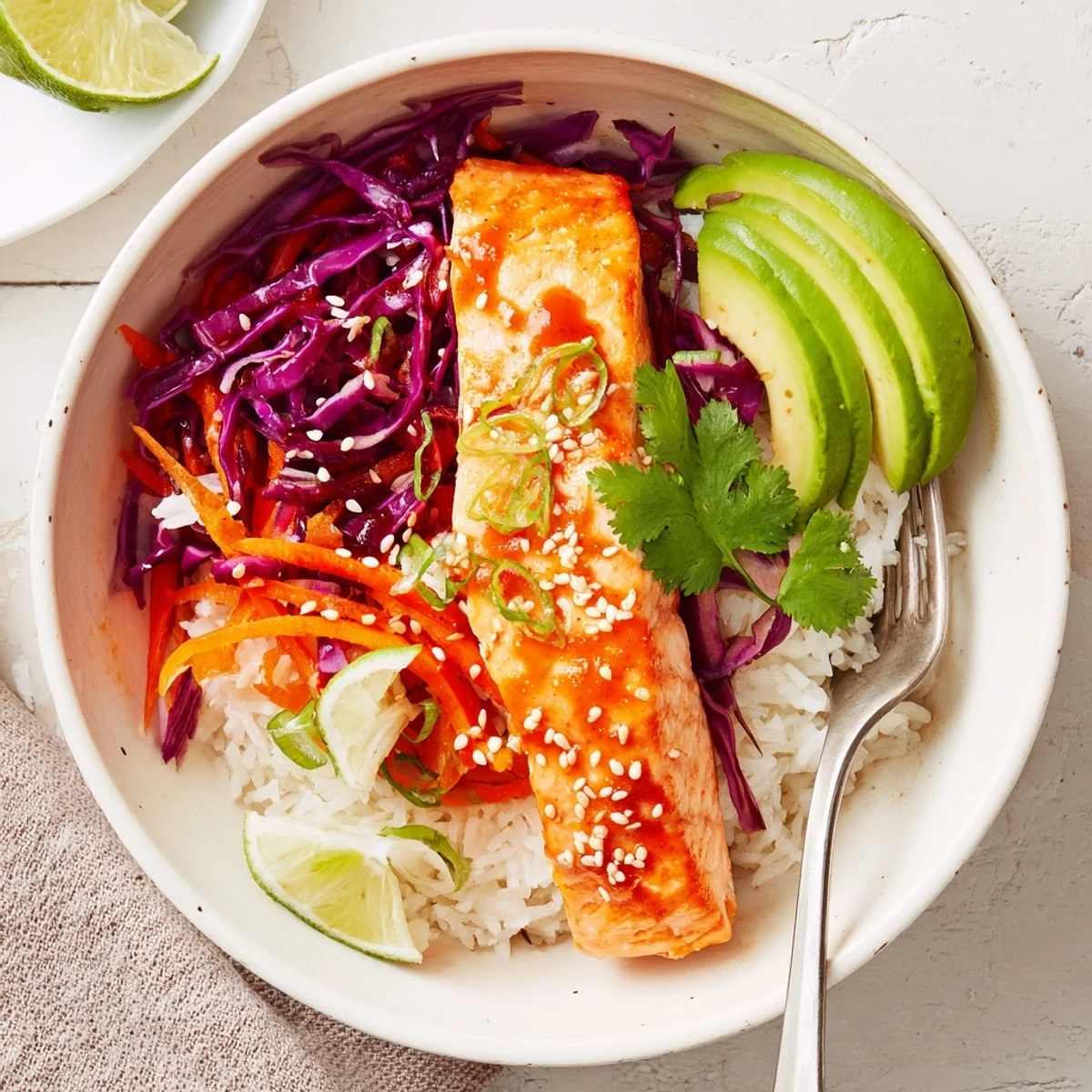 Bang Bang Salmon Bowls Recipe with roasted salmon, avocado, and creamy sauce