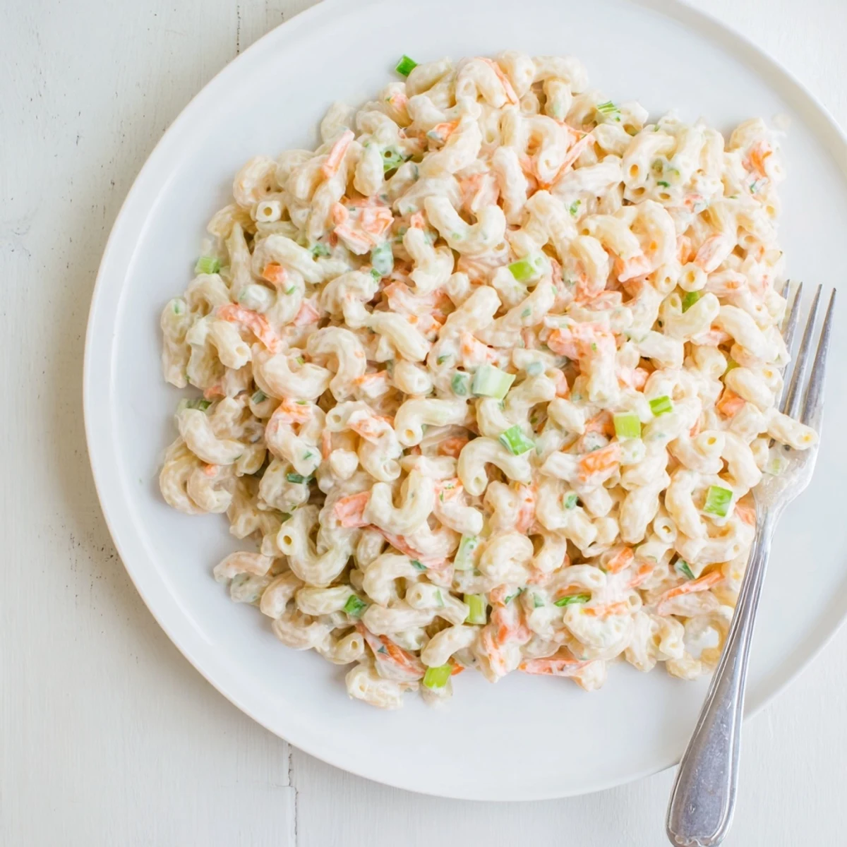 Golden elbow macaroni tossed in a velvety dressing for this authentic Hawaiian style mac salad perfect alongside grilled meats